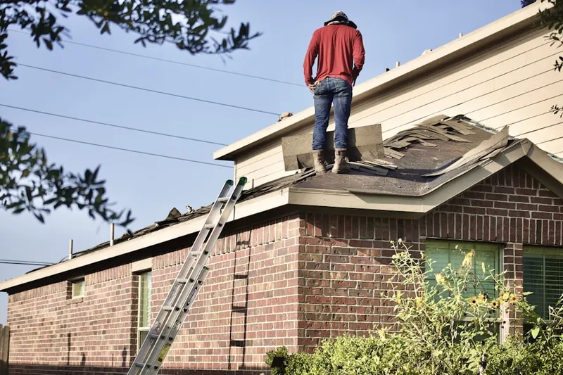 Professional roofer working on a residential roof in Habersham Hills